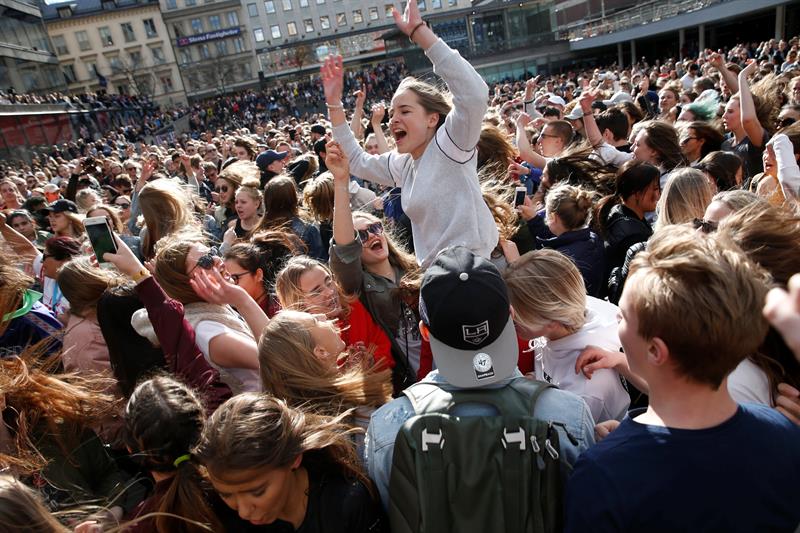 Fans of Avicii gather to honour him in central Stockholm